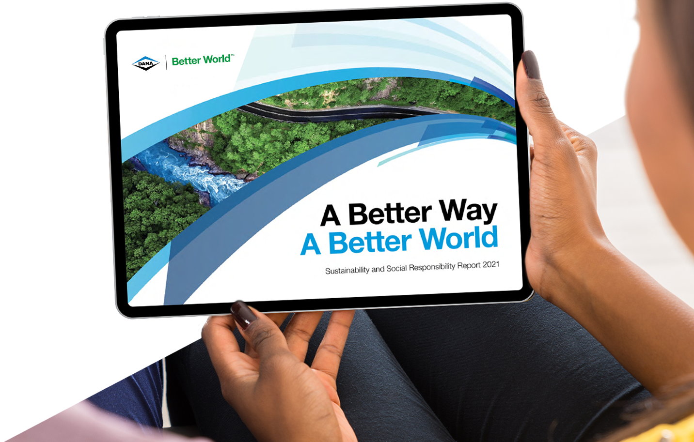 Woman holding tablet with Dana Sustainability and Social Responsibility Report 2021 cover displayed